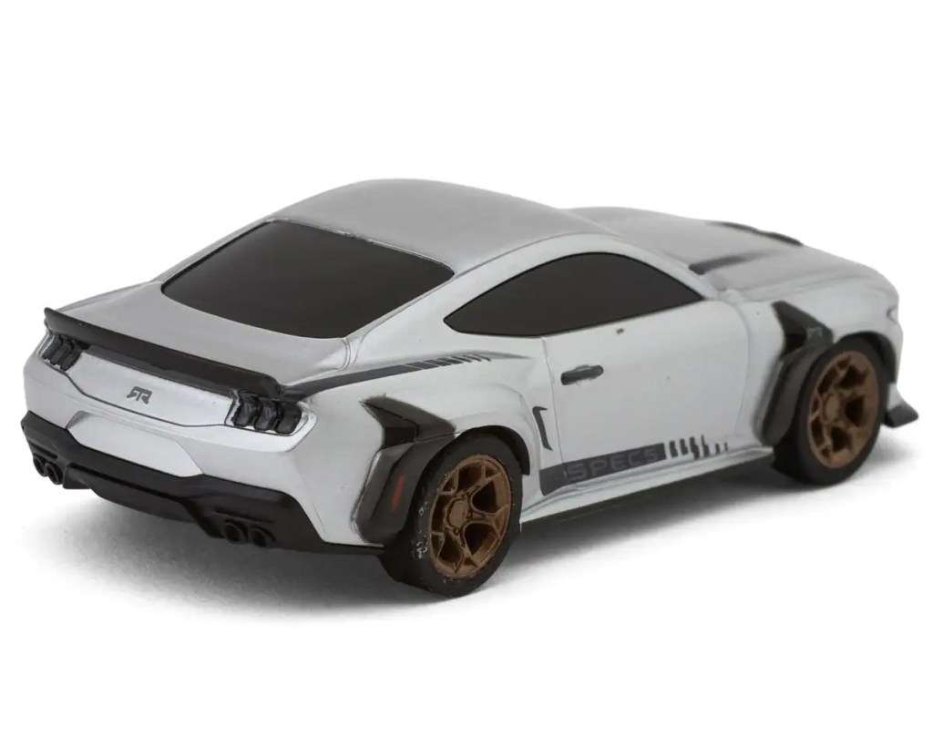 Small-scale RC car with sleek design and brown wheels for racing or hobby use.