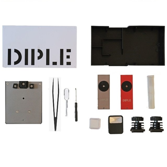 DIPLE RGS kit arranged around its box, stage, lens tiles, light and slide accessories