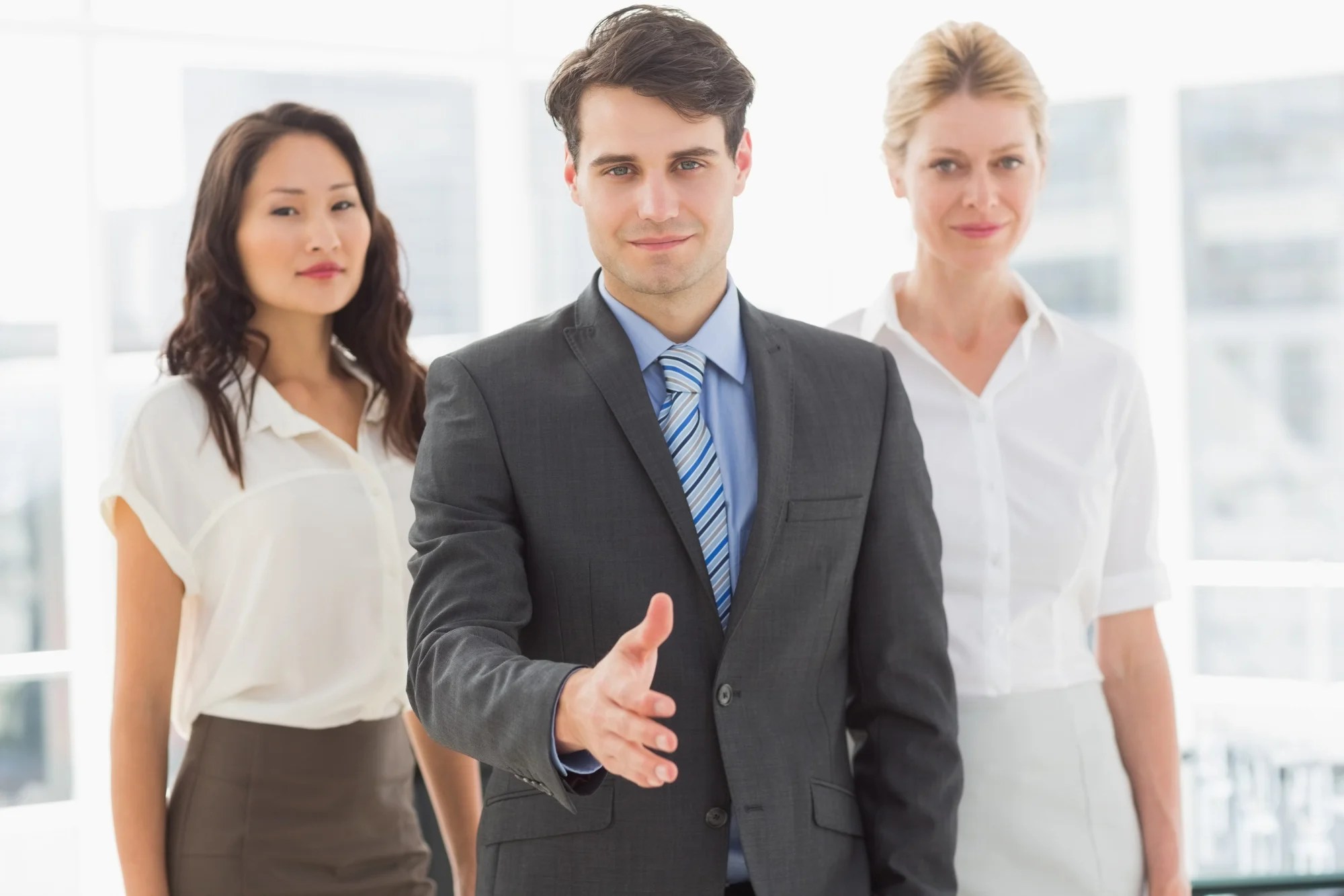 People shaking hands to finalize their partnership with SMF for EMI Lock