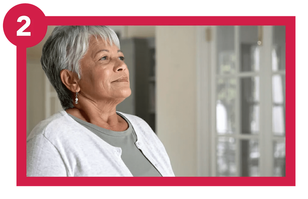 Woman living with lung condition practicing breathing exercise.