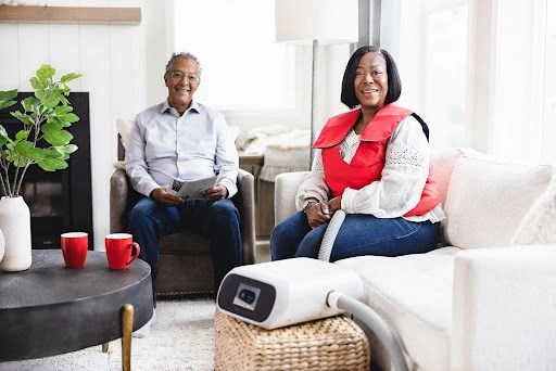 Woman wearing SmartVest in a living room