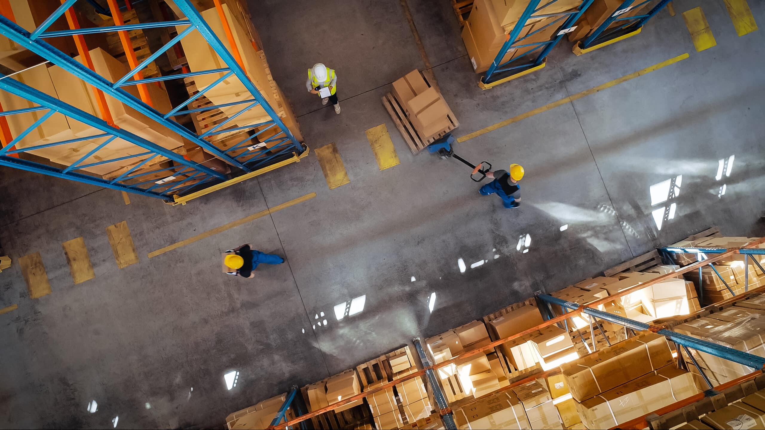 Zoomed-out image of workers in a warehouse