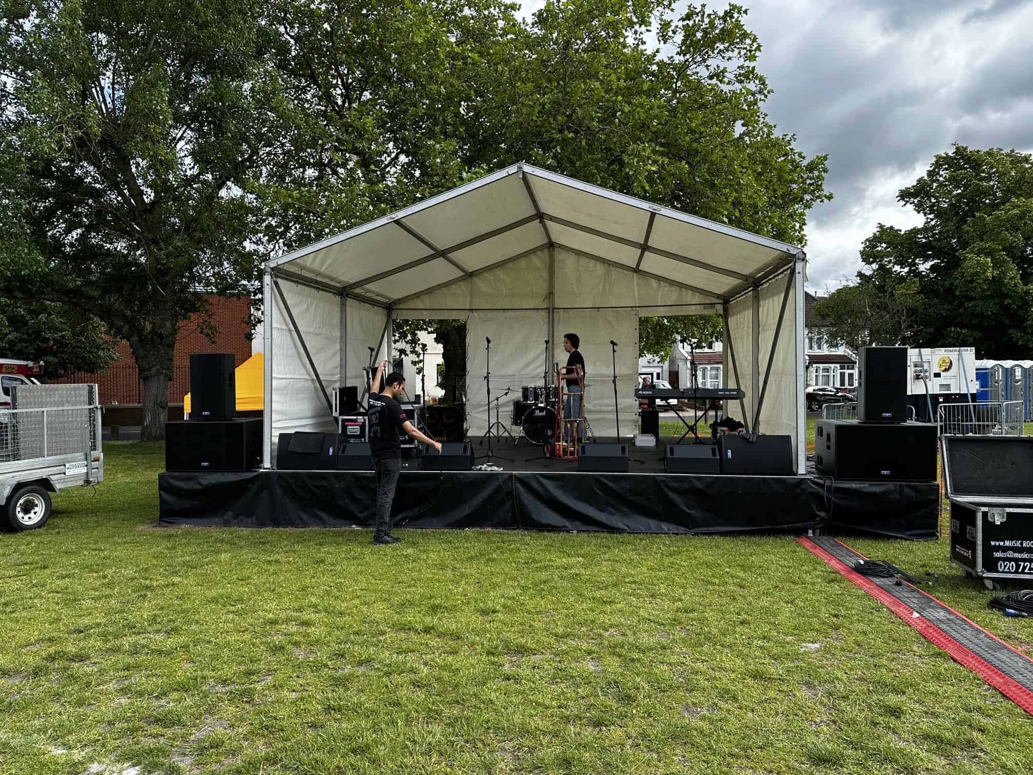 An SMH covered stage set up outdoors