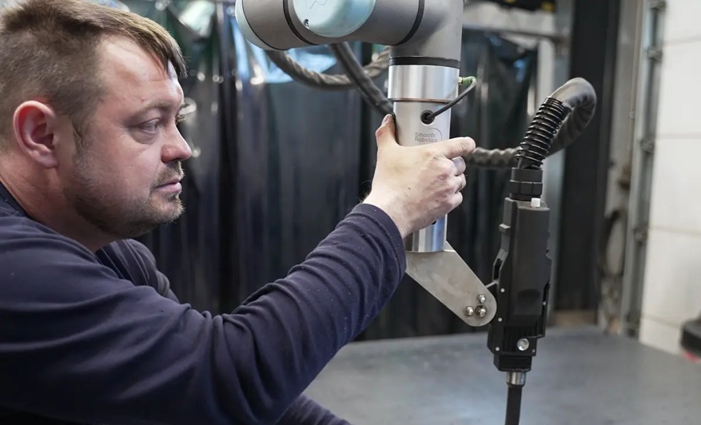 Cobots as a welder’s new tool: Who can benefit from cobot welding? 2 A welder programming a cobot welder