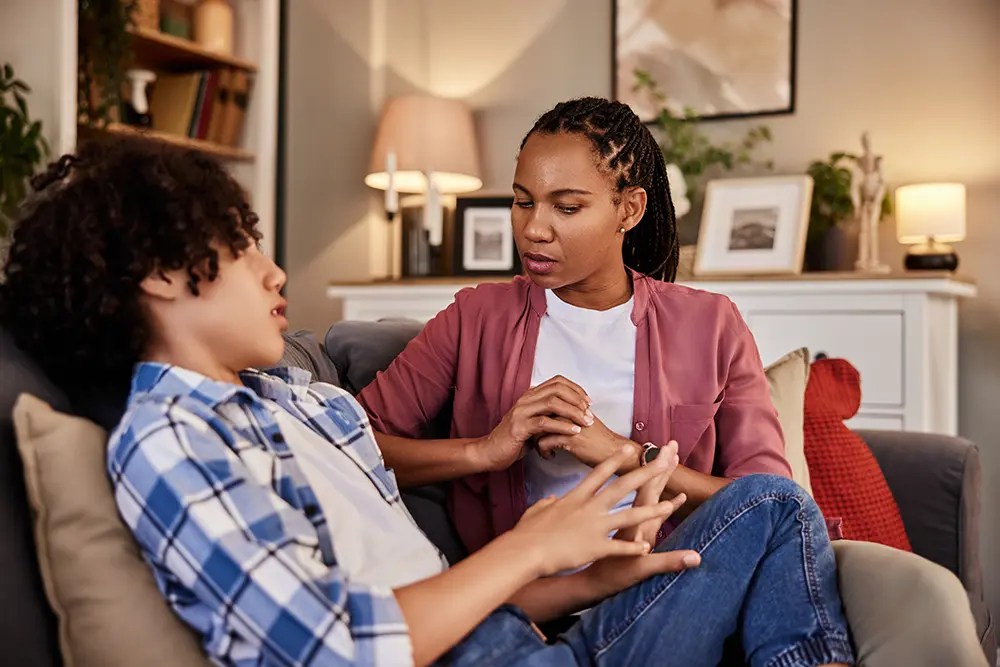 Teen Refuses To Go to School?Parent talking calmly with a teen experiencing school refusal in Calgary.