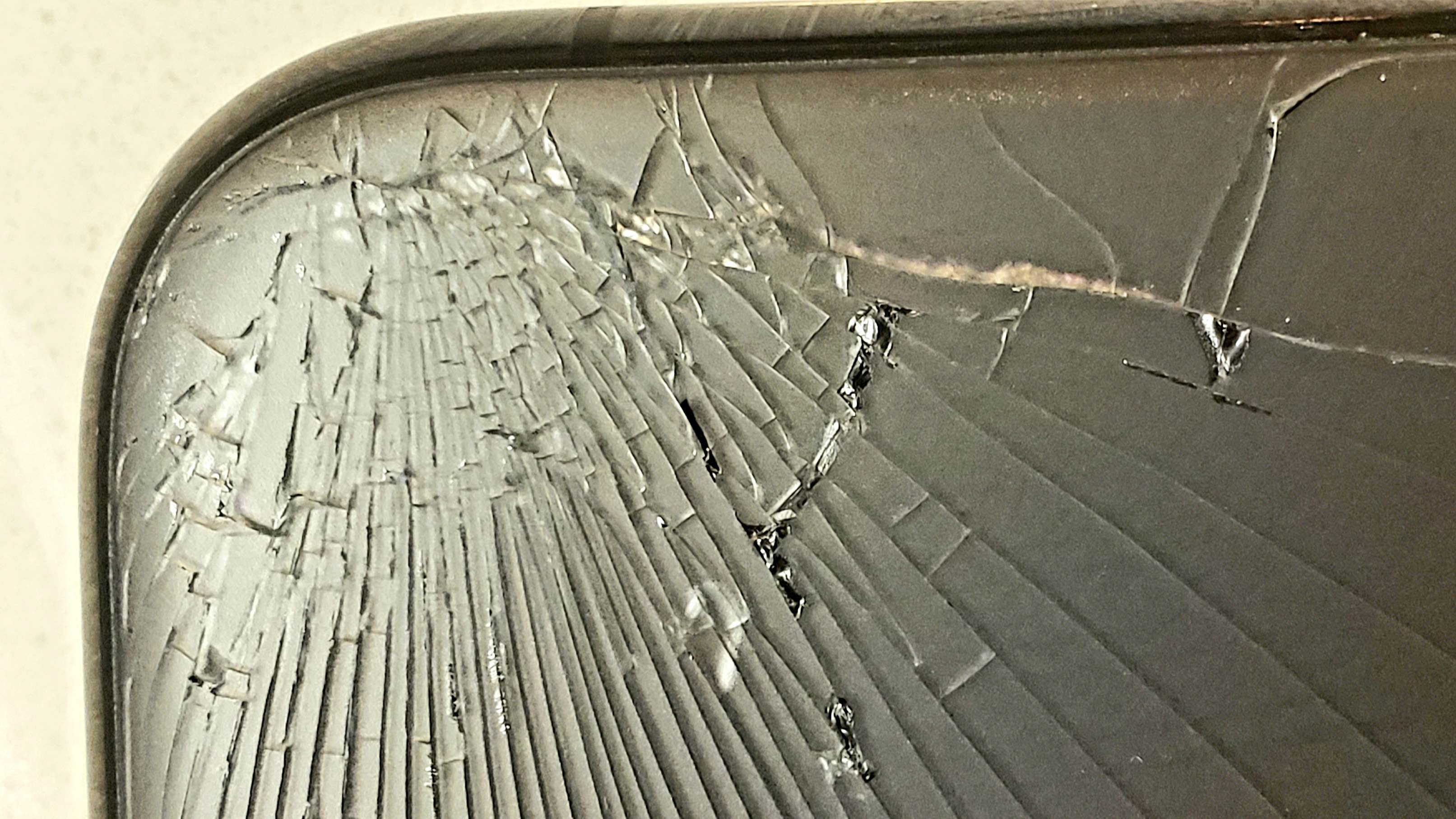 Cracked back of iphone 11 pro max and asurion won't fix