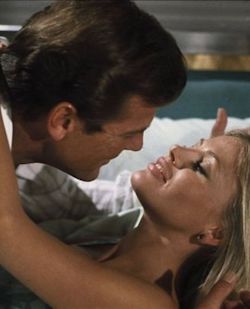 Roger Moore showing Britt Ekland his appreciation in The Man With The Golden Gun (1974)