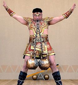 Asian Strongman with Kettleballs