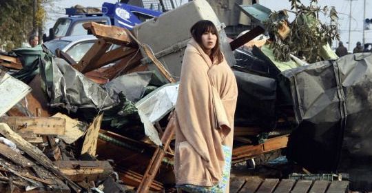 Shocked and homeless, a woman stares at the damage. Shocked and homeless, a woman stares at the damage.