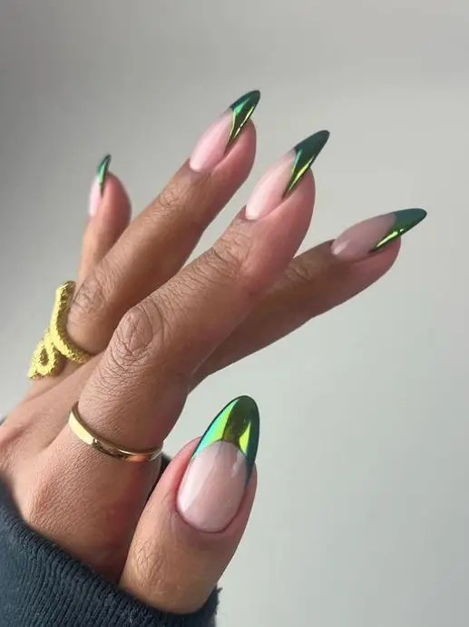 Almond nude nails with reflective metallic green chrome French tips.