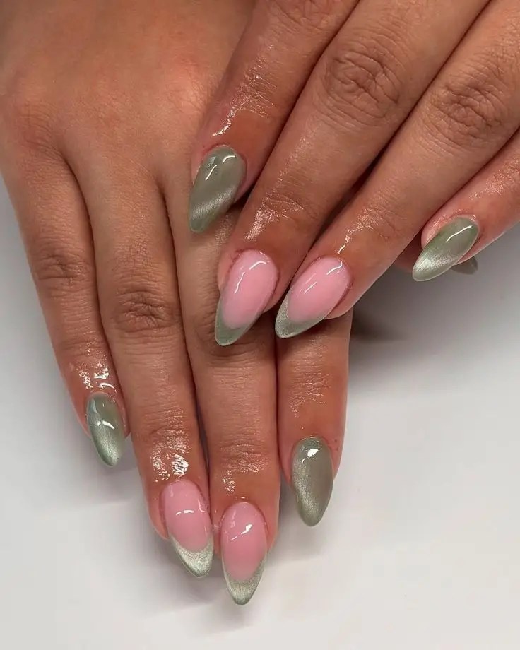 Nude almond nails with sage green velvet cat eye French tips and a soft magnetic shimmer.