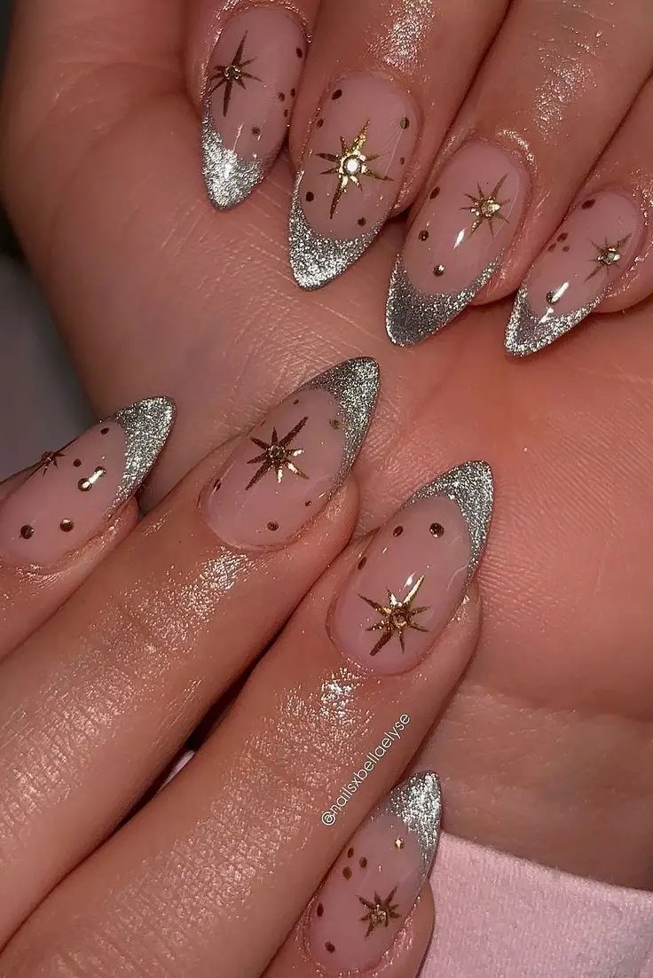 Nude almond nails decorated with small rhinestones placed evenly across each nail.