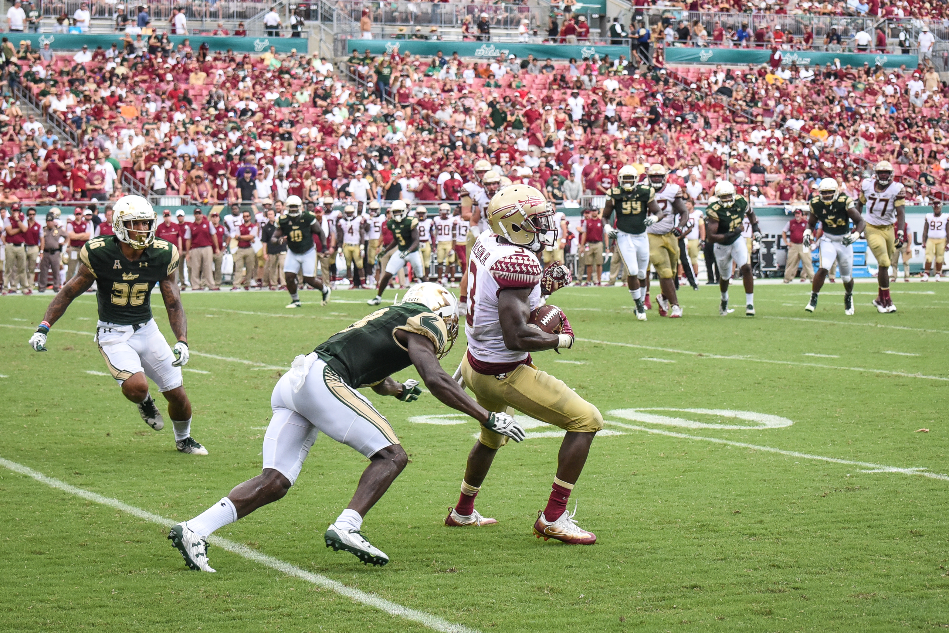 FSU vs USF 2016 102 - Jaymon Thomas tackles Jesus 'Bobo' Wilson with Nate Godwin by Dennis Akers (3127x2085)