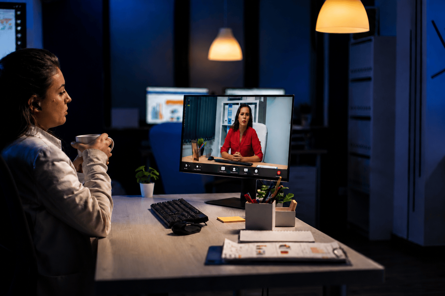 Professional attending a live online AI and Machine Learning training session on a desktop computer in a modern office with ambient lighting.