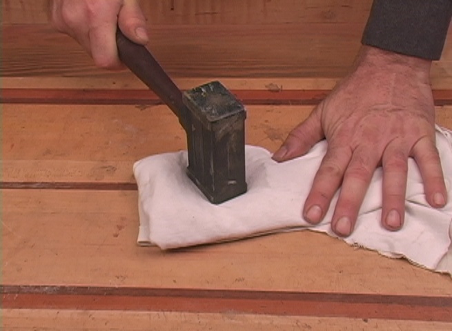 Pulverizing shellac in cotton cloth