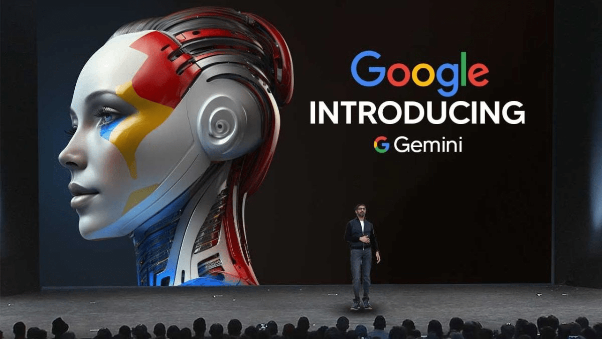 A person stands on stage in front of a large screen displaying a robotic humanoid face and the text “Google Introducing Gemini.”.