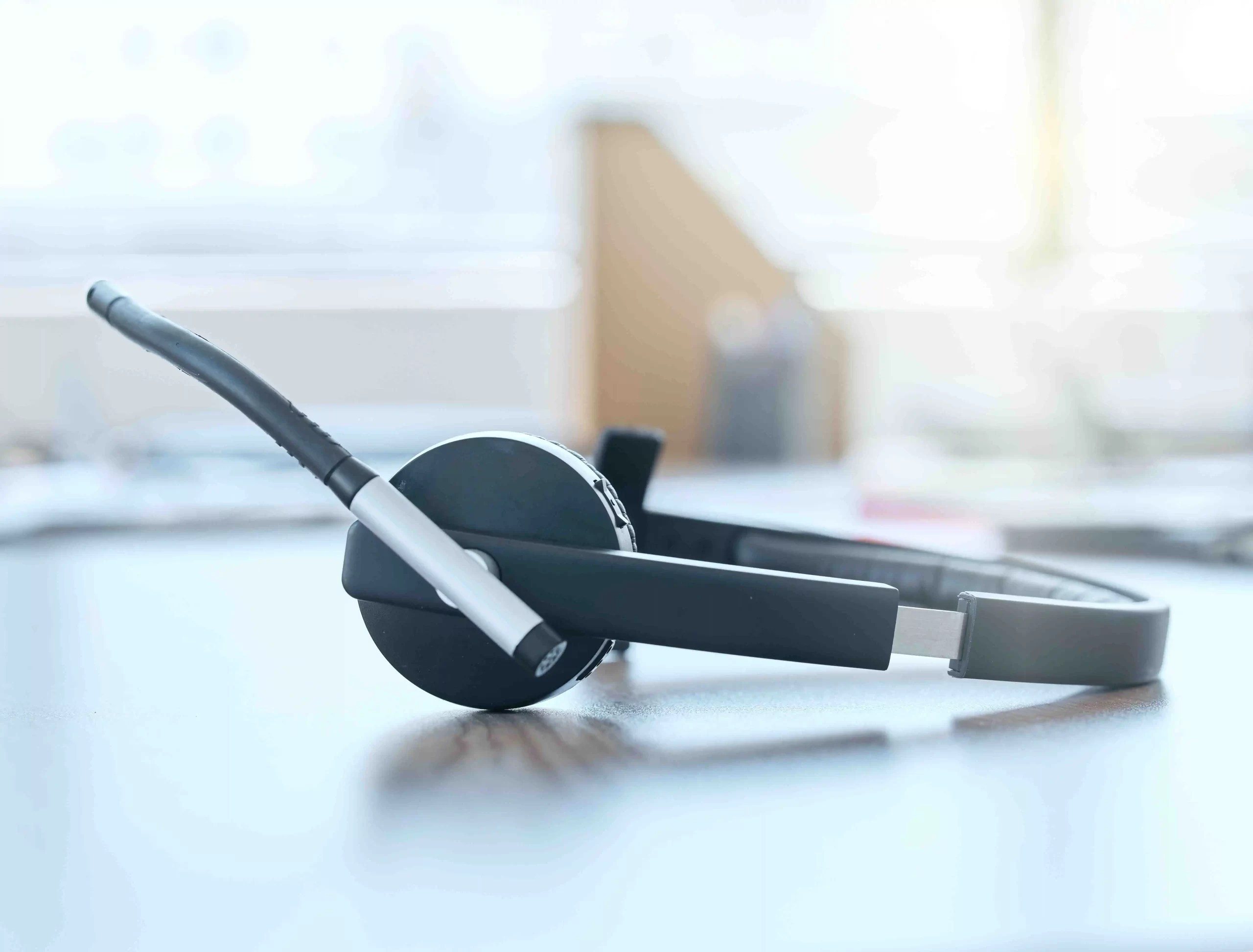 Black and white colored Headset on the table