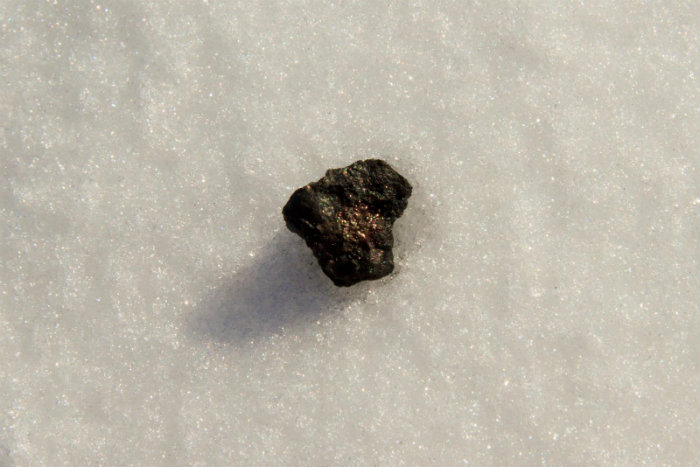 A sample found by Ural Federal University scientists at Lake Chebarkul. The object is part of the Chelyabinsk meteorite.