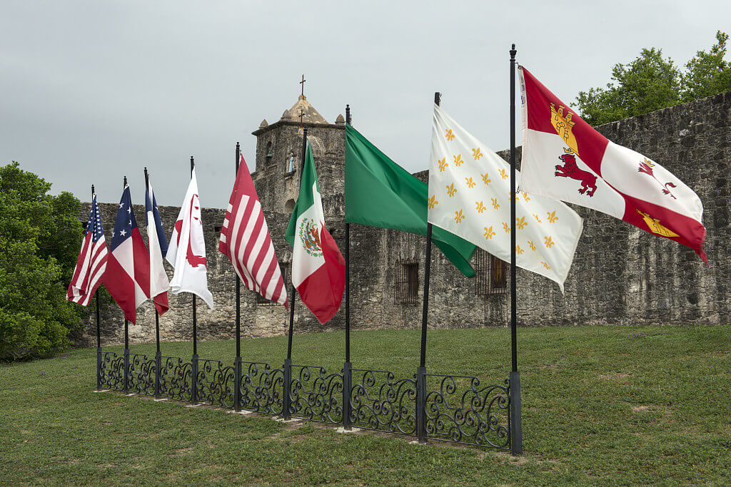 Nine flags, Presidio La Bahia, Goliad, Texas, April 5, 2014. Photograph by Carol M. Highsmith. Courtesy of the Carol M. Highsmith Collection, Library of Congress Prints and Photographs Division, http://www.loc.gov/resource/highsm.29287/. The flags, pictured left to right, represent states and revolutionary forces that once ruled Texas territory: the United States of America, the Confederate States of America, the Republic of Texas, Captain Phillip Dimmitt's Goliad Insurrection, James Long's Second Republic of Texas, Mexico, the First Republic of Texas, France, and Spain. Nine flags, Presidio La Bahia, Goliad, Texas, April 5, 2014. Photograph by Carol M. Highsmith. Courtesy of the Carol M. Highsmith Collection, Library of Congress Prints and Photographs Division, http://www.loc.gov/resource/highsm.29287/. The flags, pictured left to right, represent states and revolutionary forces that once ruled Texas territory: the United States of America, the Confederate States of America, the Republic of Texas, Captain Phillip Dimmitt's Goliad Insurrection, James Long's Second Republic of Texas, Mexico, the First Republic of Texas, France, and Spain.