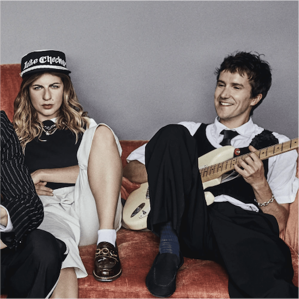 sports team band drummer and guitarist posing for album