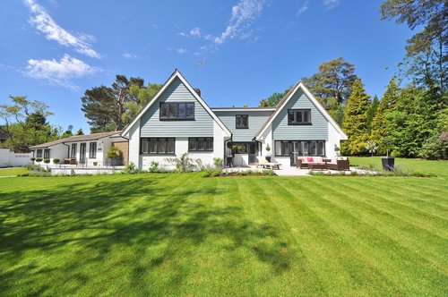 house green lawn blue sky
