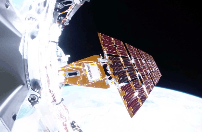 On-orbit view of the Katalyst Space Link spacecraft’s deployed solar array, with robotic servicing hardware at left and Earth below.