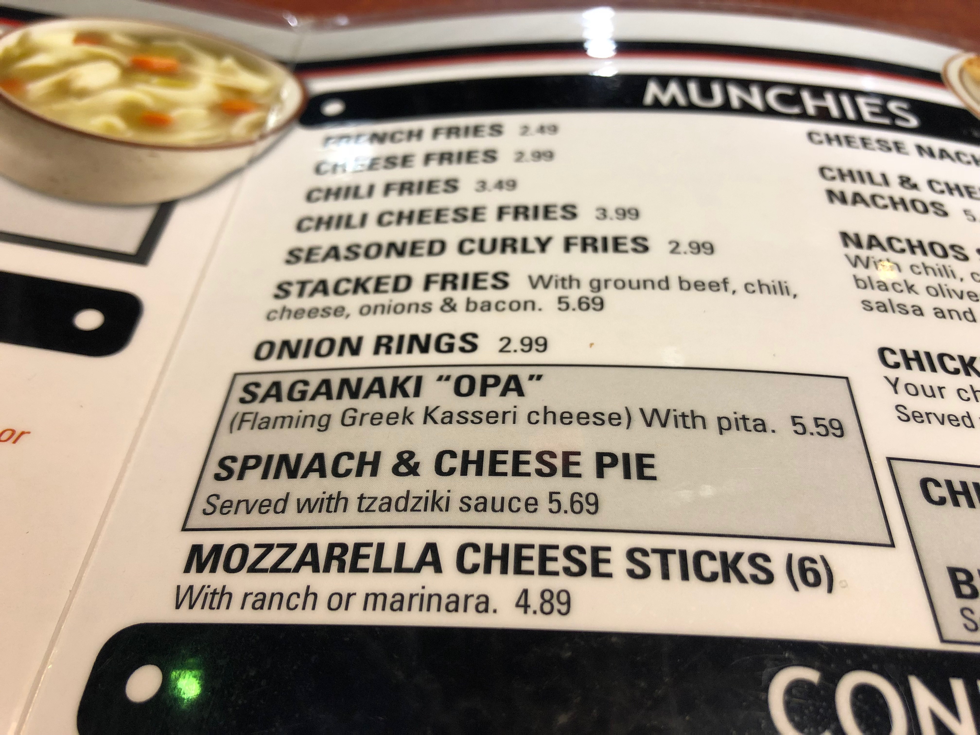 Leo’s capitalizes on their Greek background with some uniquely Grecian food, including their Saganaki Flaming cheese served with pita bread and spinach and cheese pie. Photo by Erika Greco.