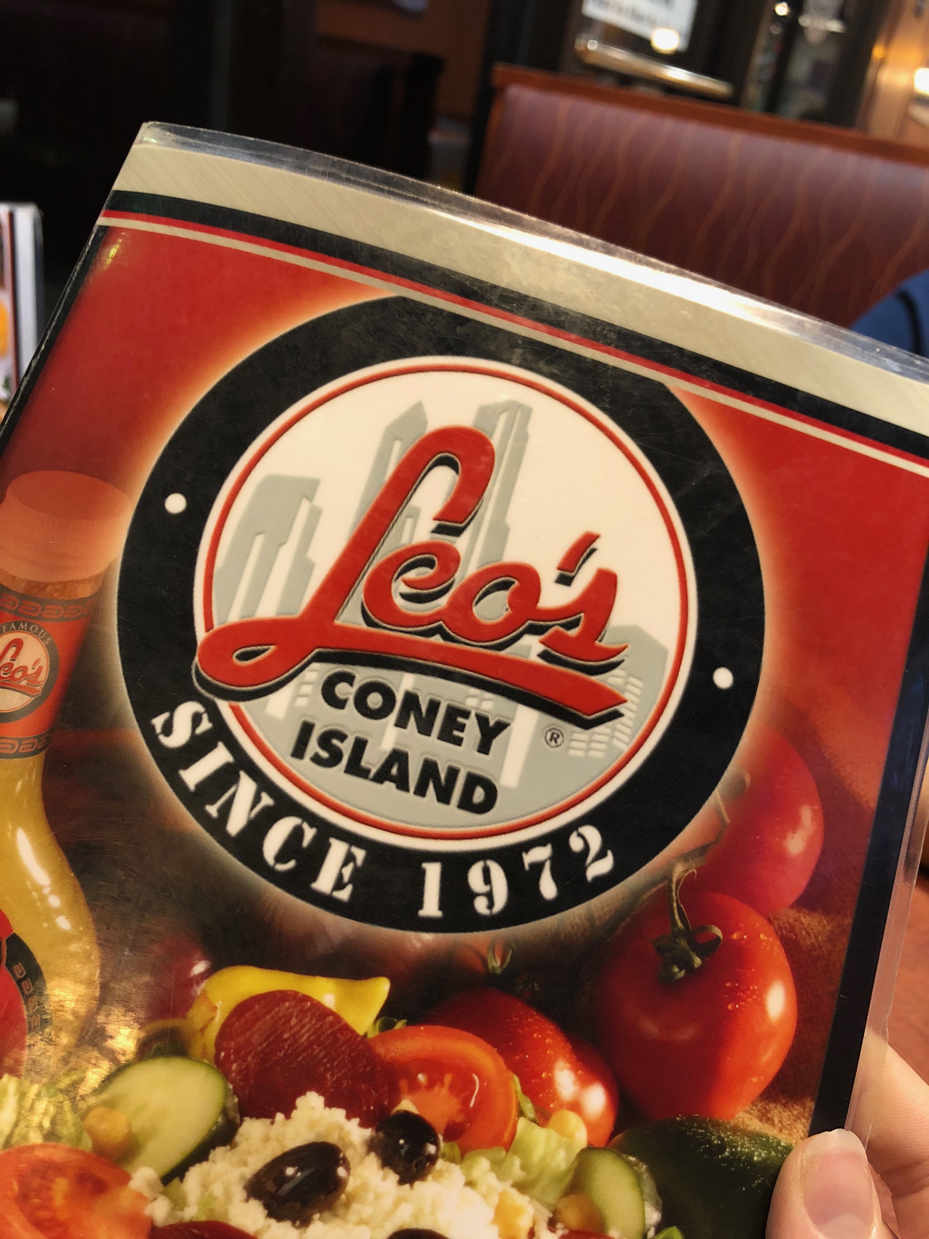 Leo's Coney Island logo is bold with a bright red “Leo’s” against black, white and greys that draws attention to its name. Photo by Erika Greco.