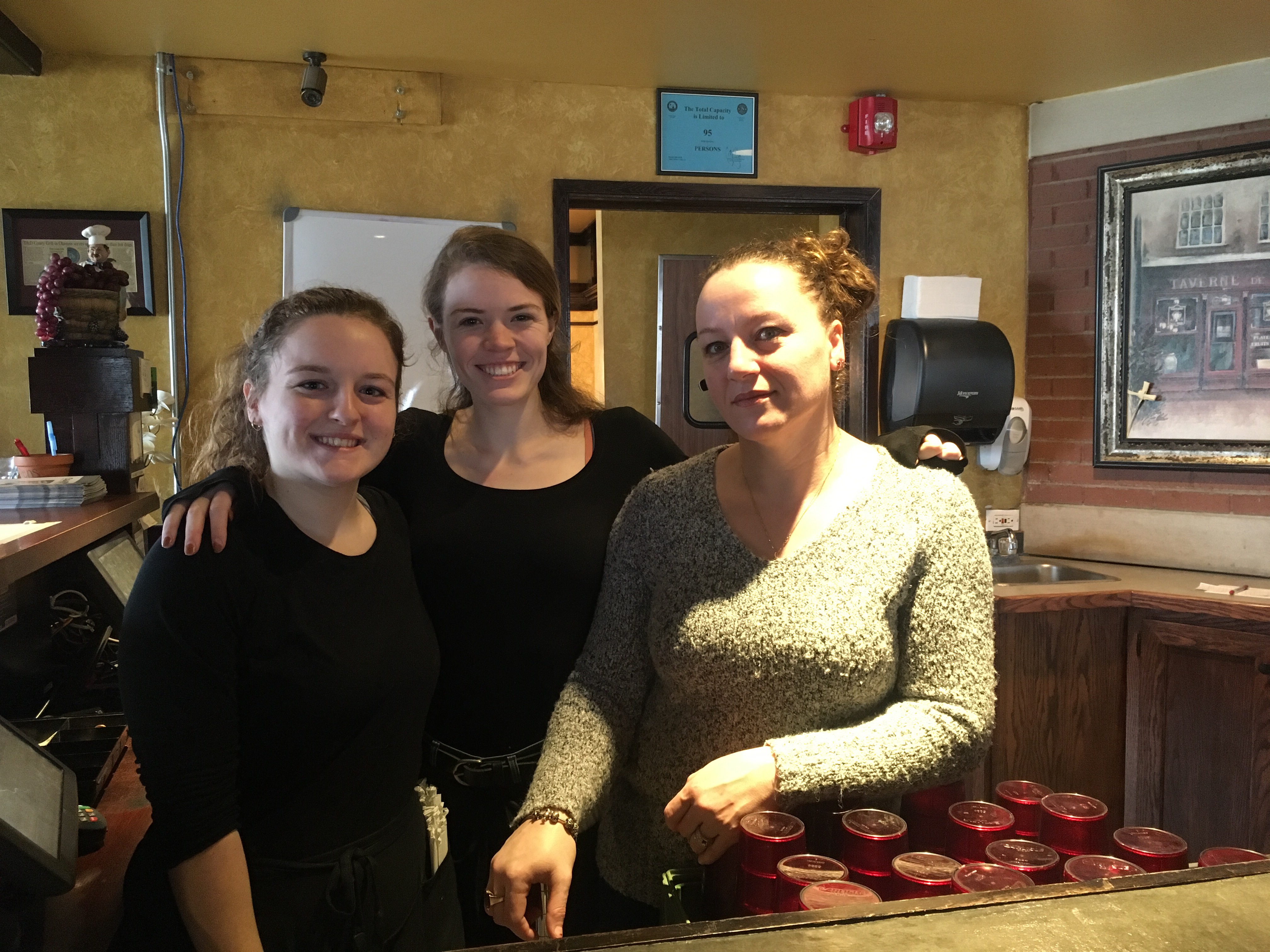 T & D Coney Grill manager Viola, right, and servers Marsela and Kendall stand in the restaurant's passbar. Viola, who declined to give her last name, said although their restaurant is tucked away, they get a ton of regulars. Photo by Jamal Tyler.
