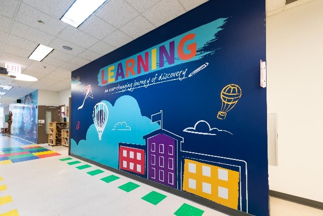 School mural with creative interior design, highlighting the ceiling and flooring.