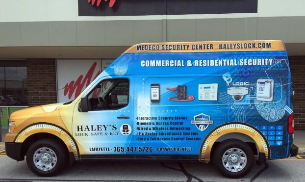 Light commercial van with advertising, featuring durable and customizable car wrap.