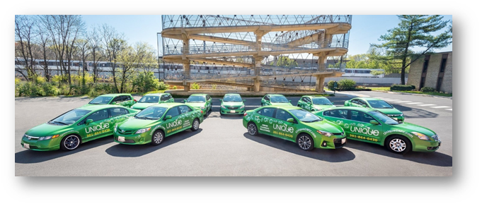 Motor vehicle group of green cars in parking lot, showcasing automotive exterior design.