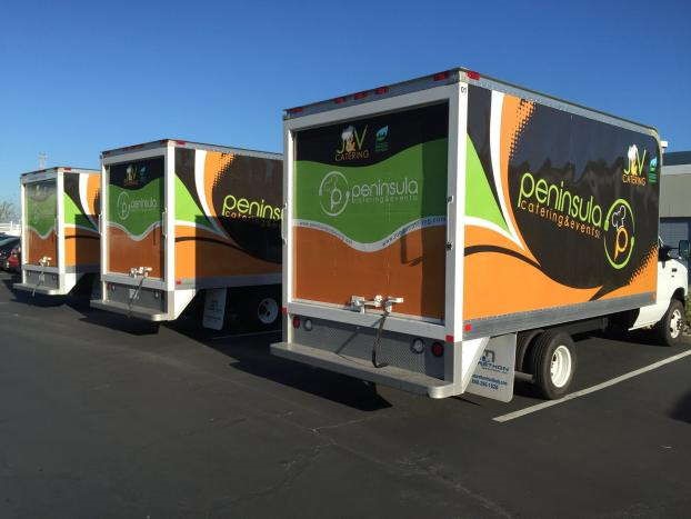 Commercial vehicle trailers parked, showcasing automotive wheel systems in a lot.