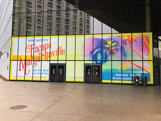 Large building showcasing prominent outdoor advertising