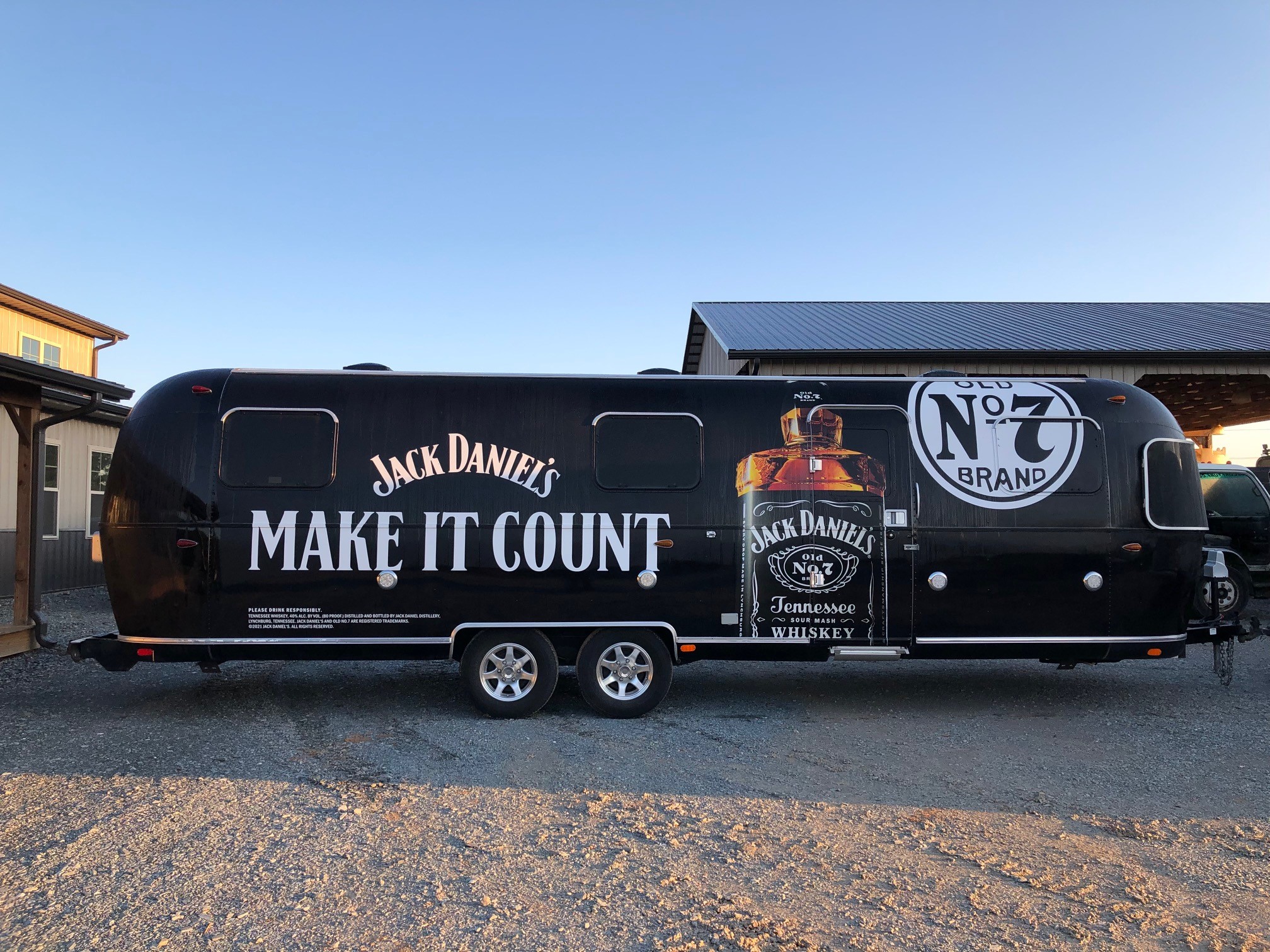 Logo on black trailer with white lettering, emphasizing bold design