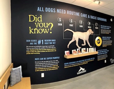 Dog-themed advertising mural with a vibrant canine design.