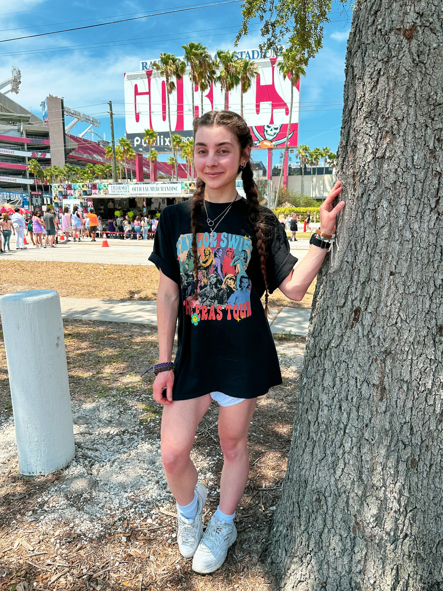 Lisa standing next to a tree outside of Raymond James Stadium.