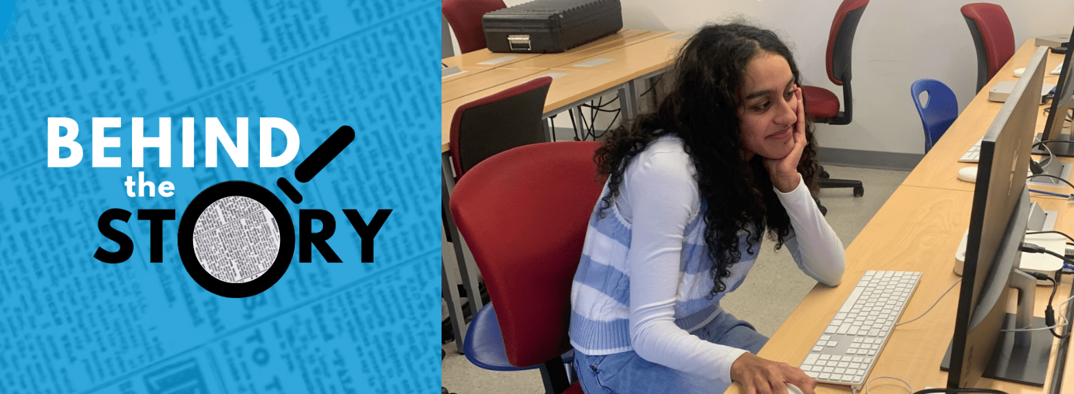 Sahana Unni working at a desktop in her newsroom with the Behind The Story logo to the left