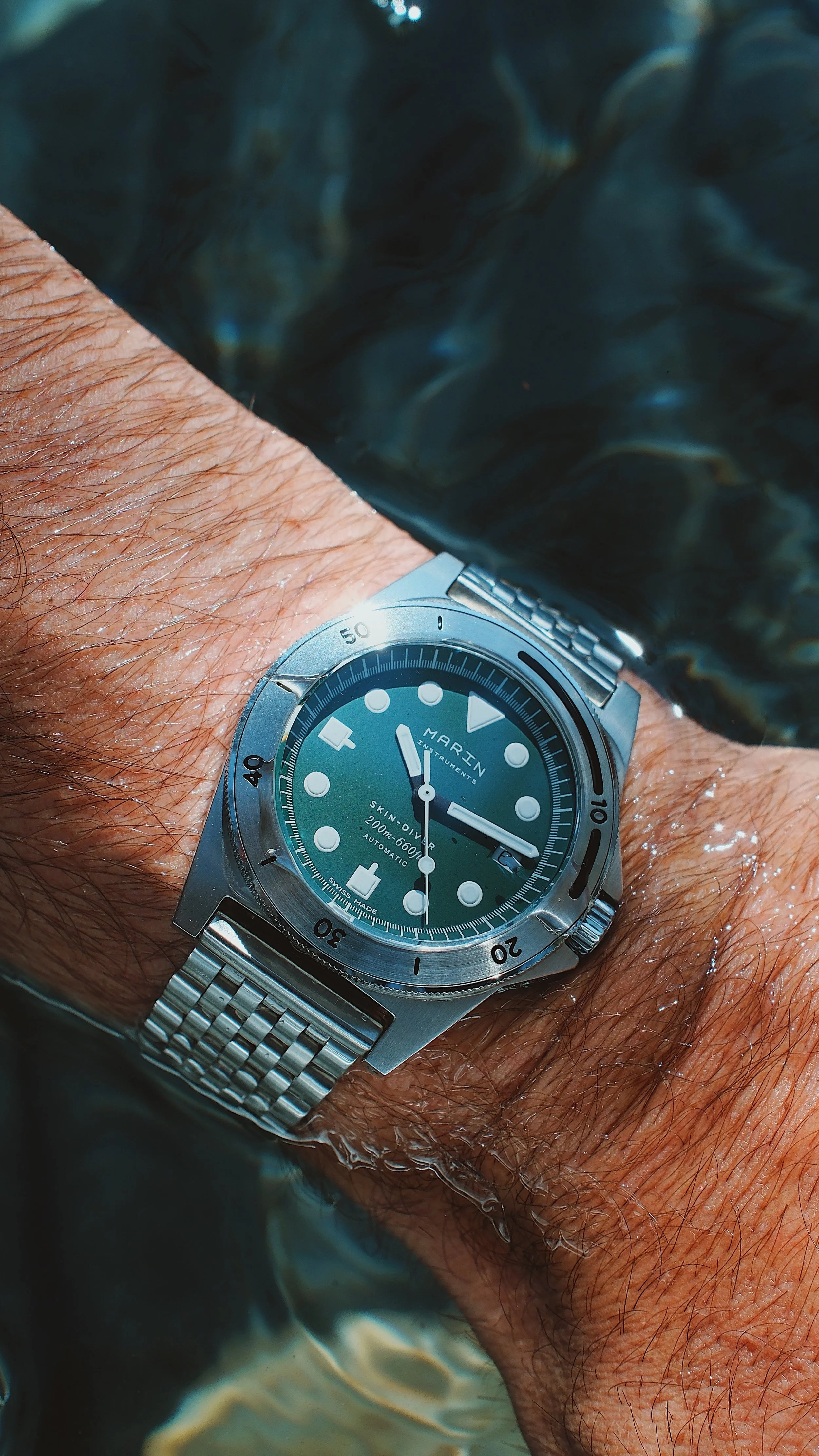 The Marin Instruments Skin-Diver, a 39mm steel dive watch with a fully lumed bezel