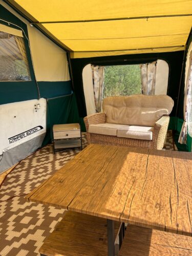 View of the awning interior of a deluxe trailer tent