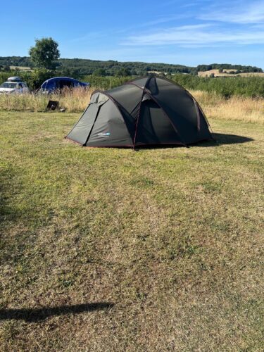 A green tent pitched on one of our spacious non electric pitches