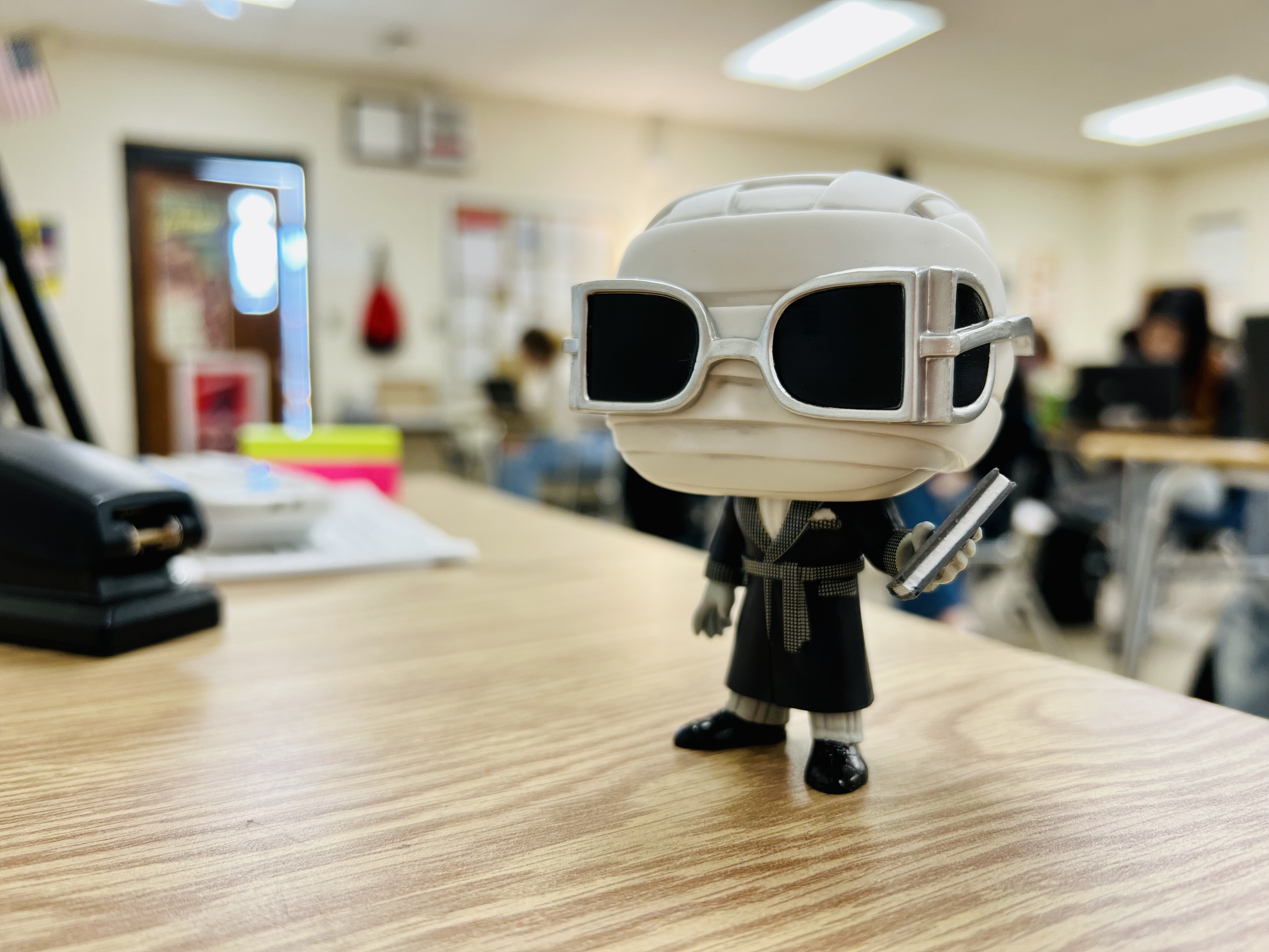 Funko Pop figurine of the 1933 film The Invisible Man, in Mr. Nannini's classroom.
