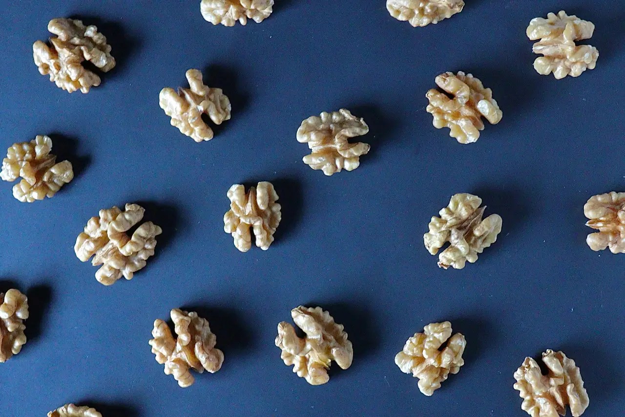 walnuts on blue background