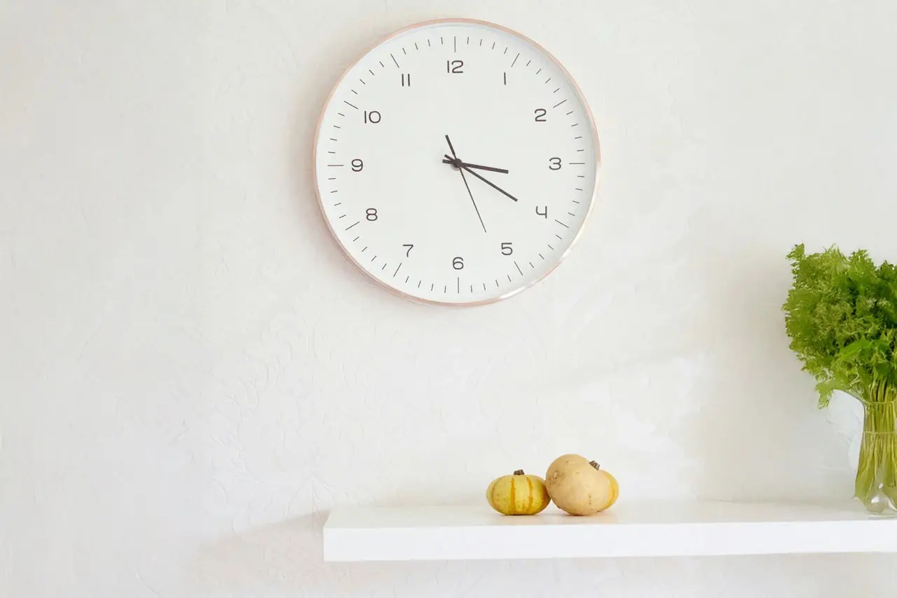 wall clock and shelf with fruit