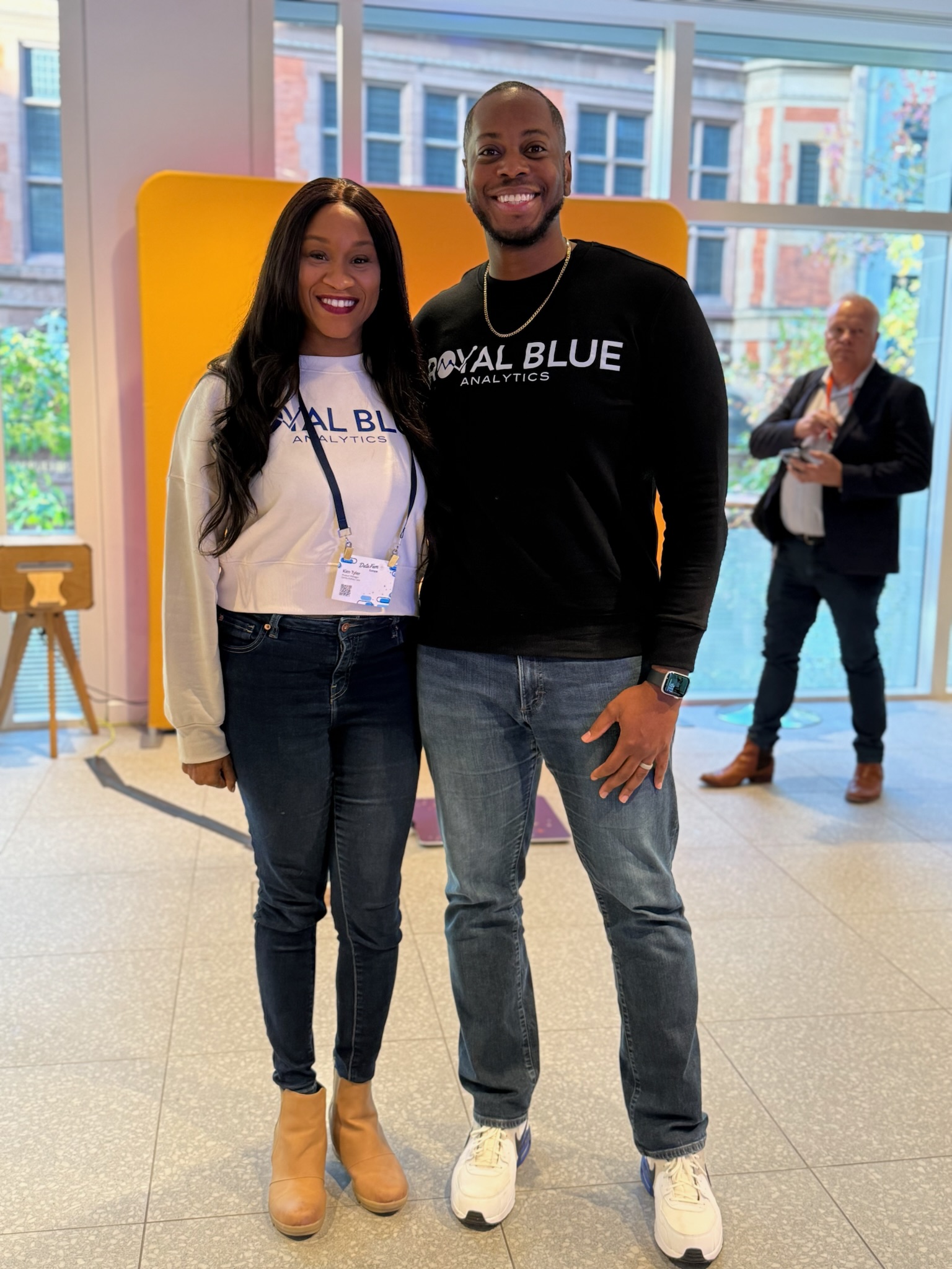 Sekou Tyler and a colleague in Royal Blue Analytics shirts at DataFam Europe in London