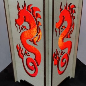 Year of the Dragon lantern showing dragon silhouette with red hanji paper and flicker flame bulb