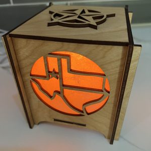 Texas Icons lantern with orange bulb State shape side