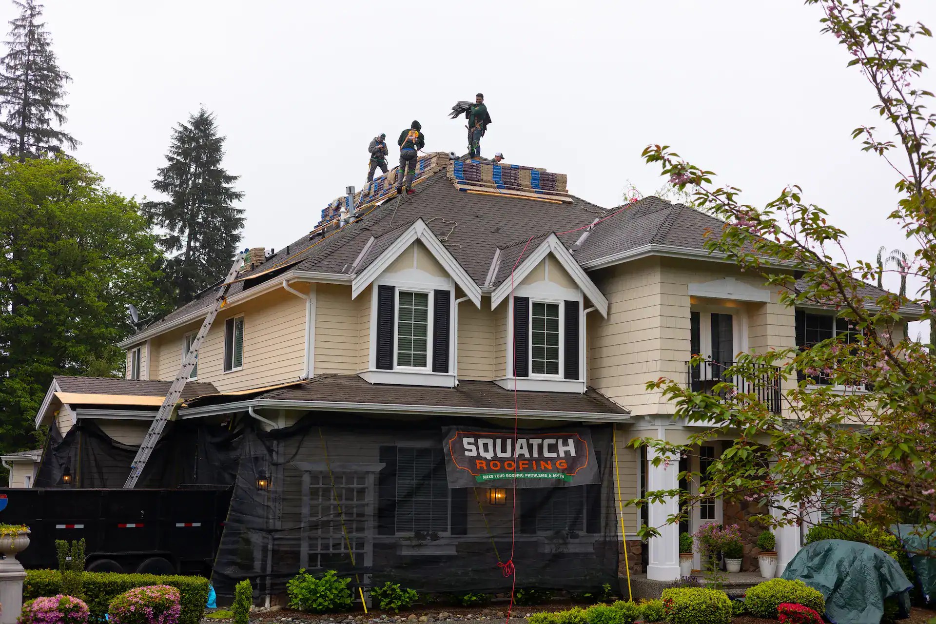 Squatch Roofing crew on roof