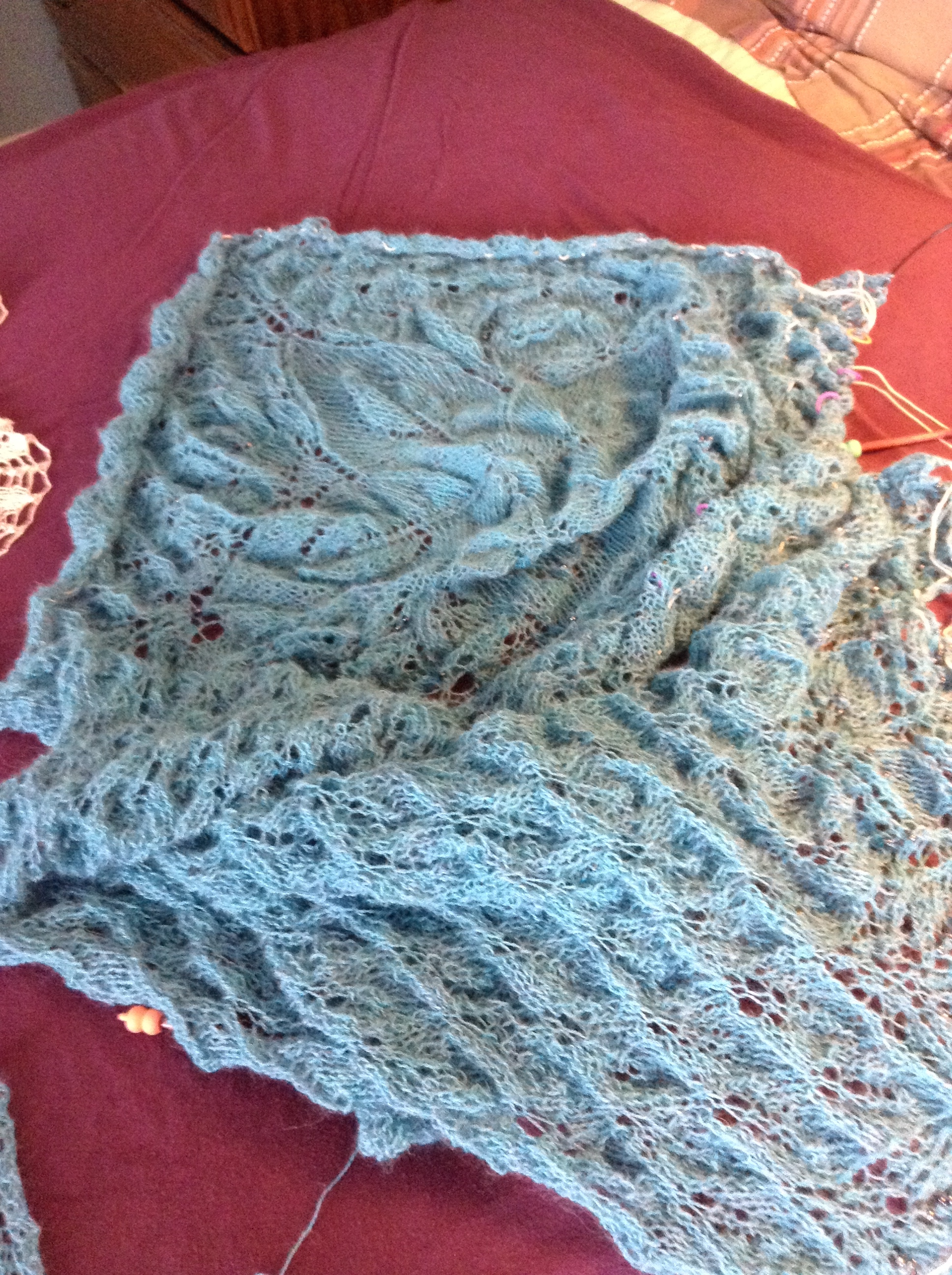 Second Fiori Autunnali in turquoise heather alpaca, before blocking. Looks pretty ridiculous at this stage! (And no, this is not finished; I'm including partly so you can see the difference between the finished ecru shawl and one in progress, and partly because at the rate I'm going this may never come off the needles.)