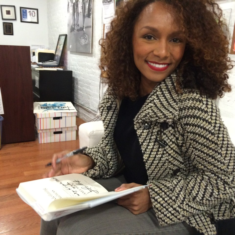 Janet Mock signing Redefining Realness for SRLP's Small Works For Big Change